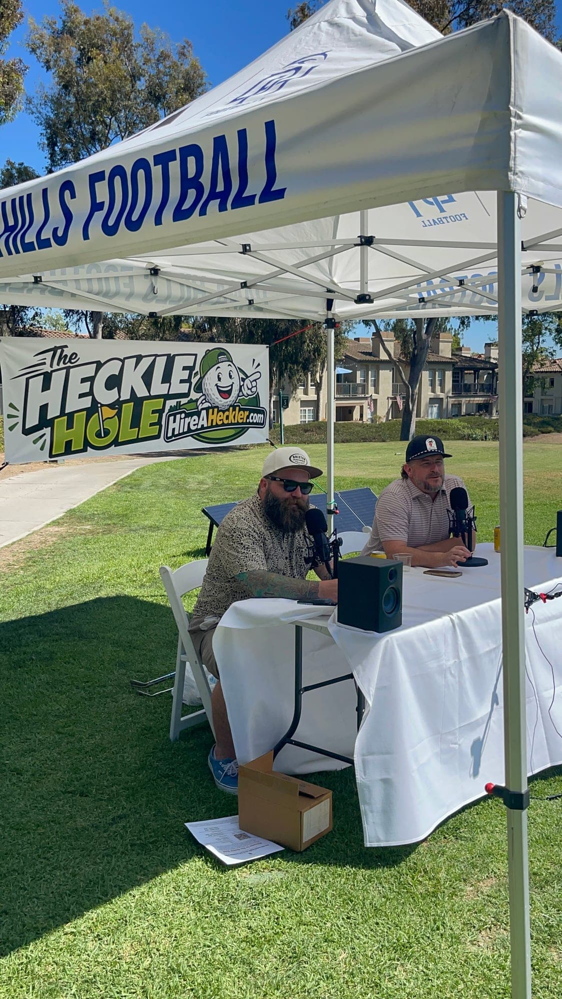 Hire A Heckler comedians Scott Busby and Tanner K at The Heckle Hole during the Dana Hills Football golf tournament